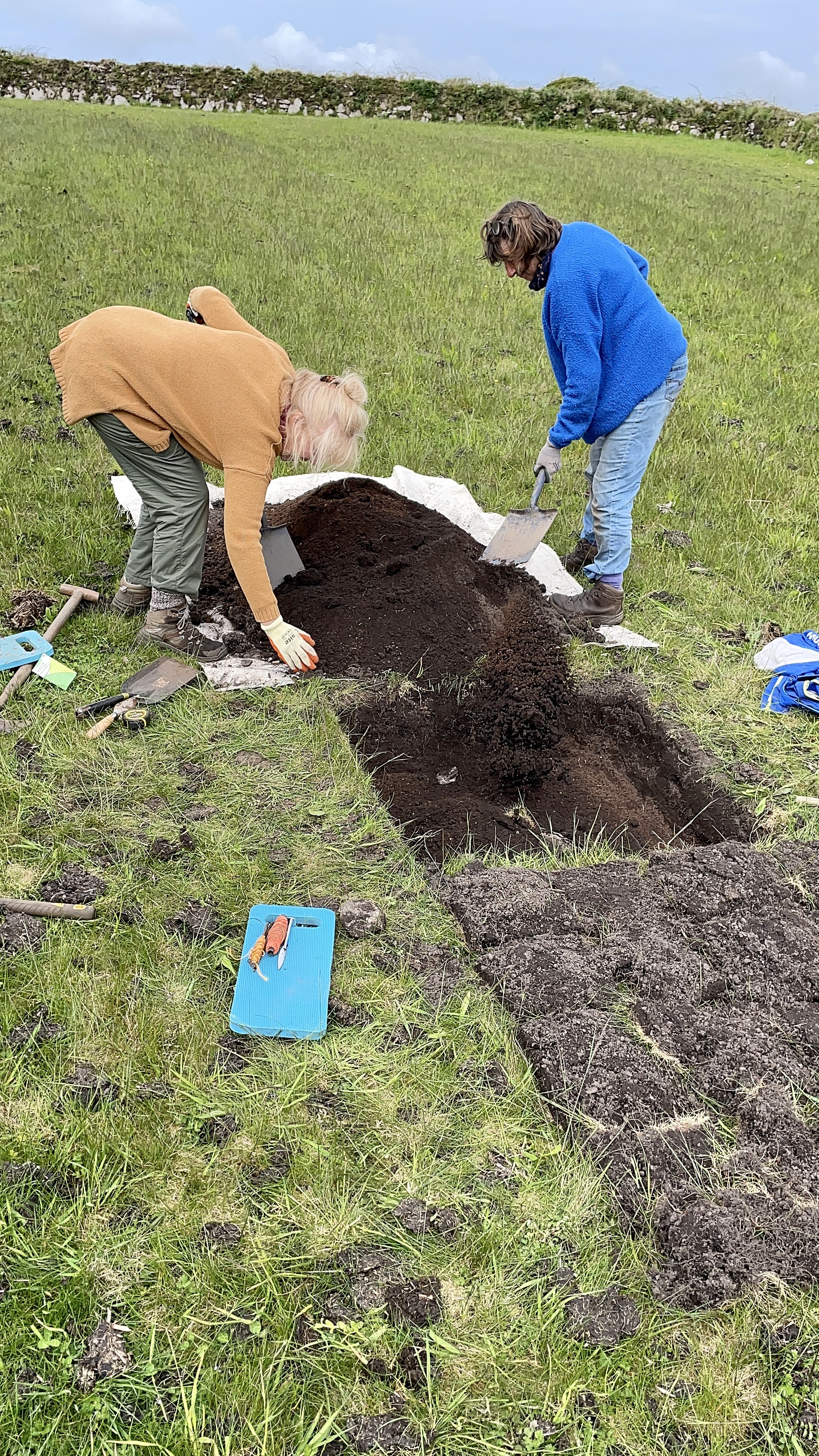 PLP Volunteers Rhona and Jocelyn backfilling a trial pit at Hillside Farm